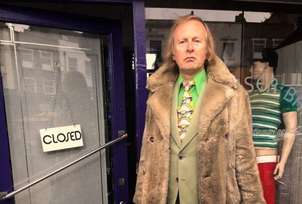 Brian Robinson in a fur coat on the set of Trouser Bar (2016). 