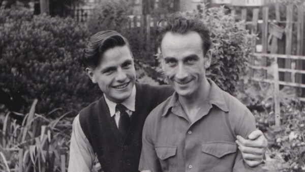Reg and George pictured in black & white in their garden in the 1950s from the LGBT short film Rhiw Goch